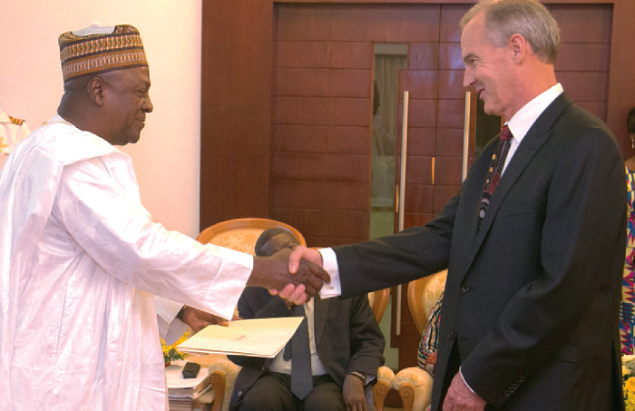  The incoming Australian Ambassador to Ghana, Andrew Barnes (right), presenting his Letters of Credence to President John Mahama at the Flagstaff House